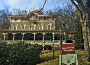 The Italianate Asa Packer Mansion with its museum sign on the hillside in Jim Thorpe, Pennsylvania