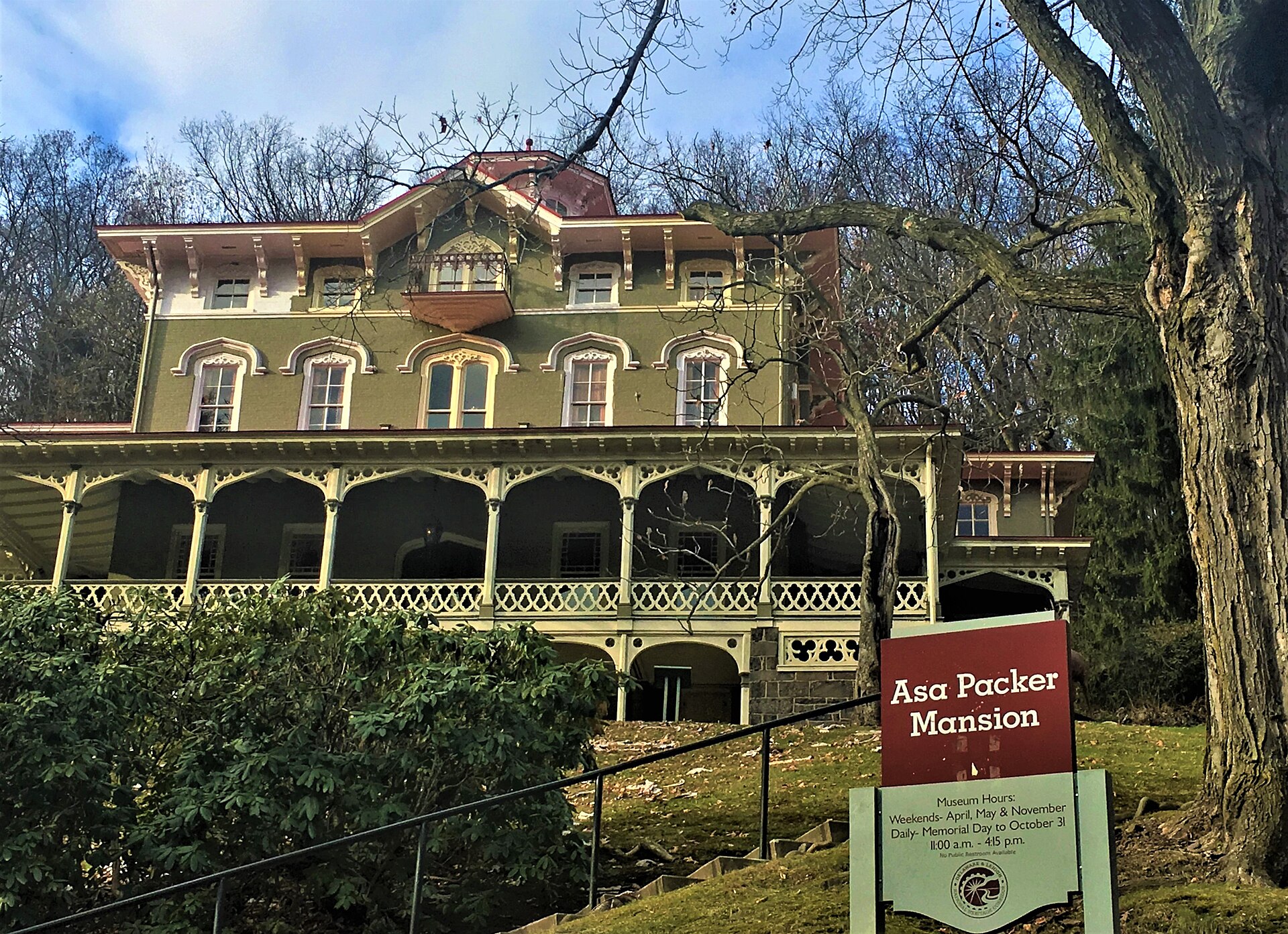 The Italianate Asa Packer Mansion with its museum sign on the hillside in Jim Thorpe, Pennsylvania
