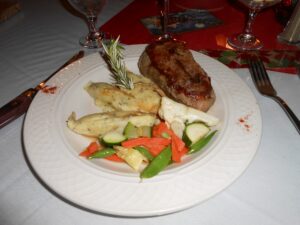 A ribeye steak dinner served at a restaurant table