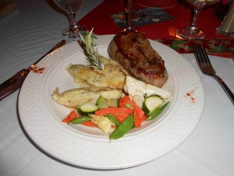 A ribeye steak dinner served at a restaurant table