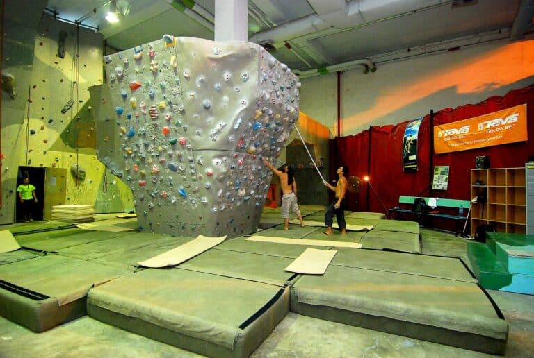 An indoor climbing wall with colorful holds
