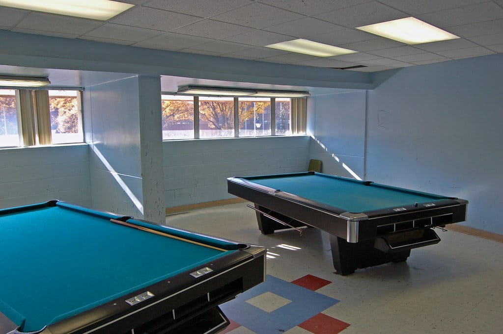 Game room with pool tables, comparing amenities in the Mountain Getaway vs the Group Getaway in Lake Harmony