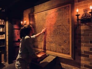 Players solving a puzzle in an escape room