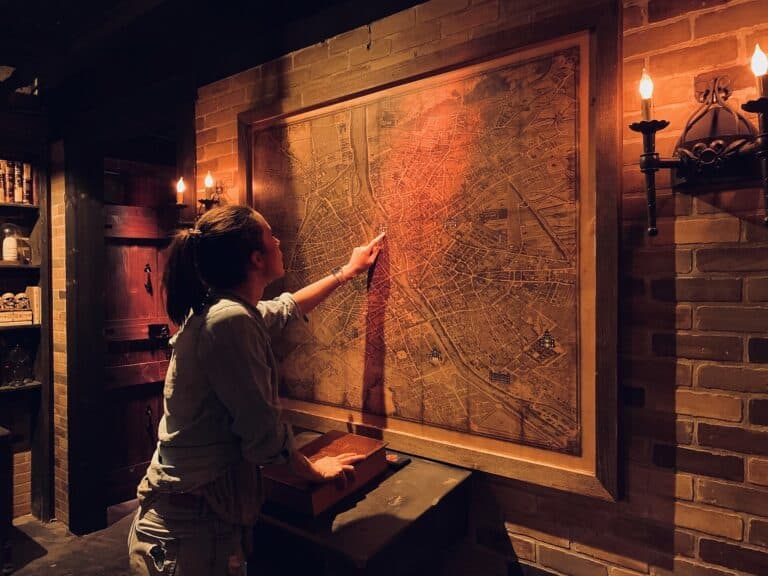 Players solving a puzzle in an escape room